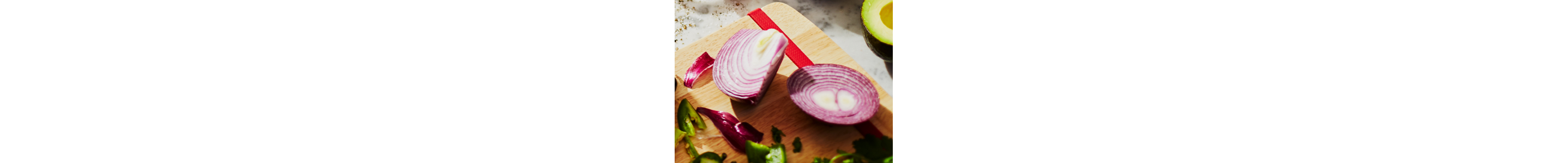 Sliced onion resting on a cutting board.