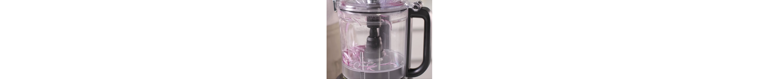 Chopping onions whirring in a food processor.