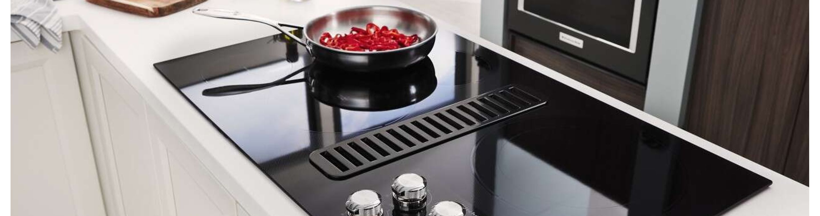 A pan simmering on a KitchenAid® ceramic glass stove top