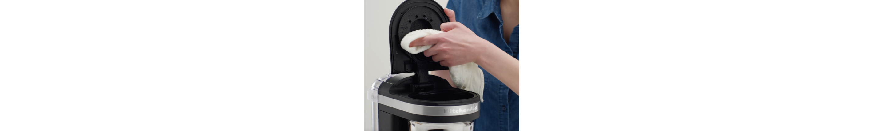 Hand cleaning drip coffee maker shower head with a cloth
