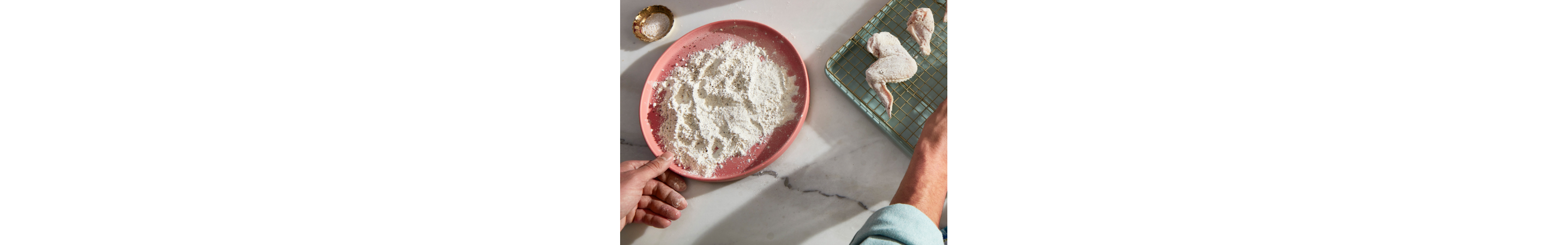 Prepping food for a KitchenAid® countertop oven with air fry.
