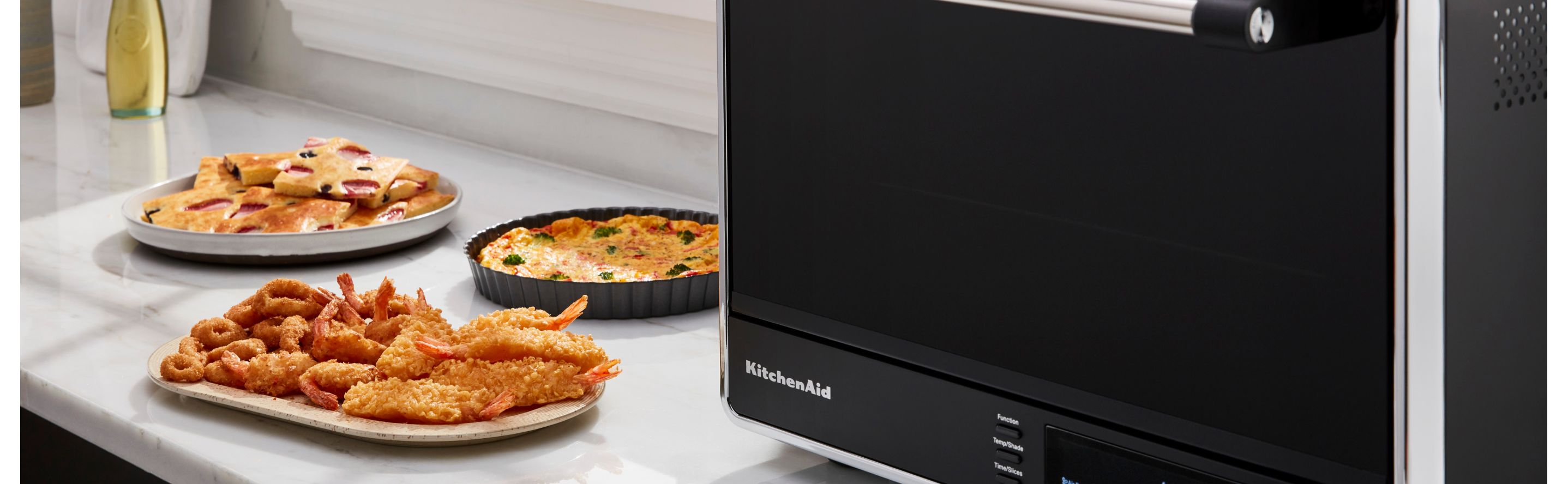 https://www.kitchenaid.com/is/image/content/dam/business-unit/kitchenaid/en-us/marketing-content/site-assets/page-content/pinch-of-help/how-to-cook-shrimp-in-an-air-fryer/Shrimp-in-Air-Fryer-Masthead.jpg?fit=constrain&fmt=jpg&wid=2875