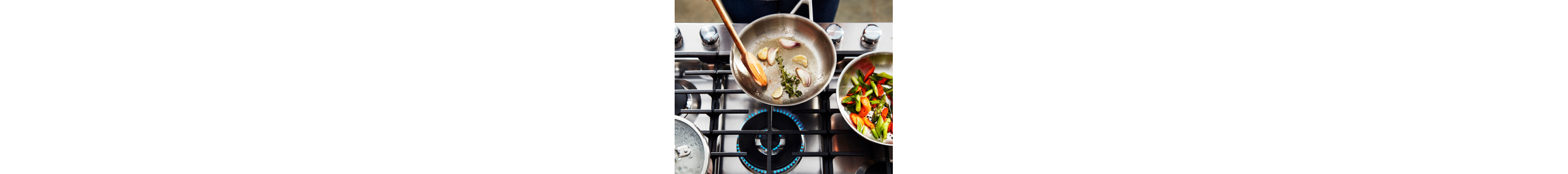 Aromatics sauteing in a frying pan