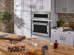 Stainless steel appliances in a modern kitchen with food on the kitchen island