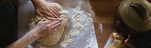 Hand mixing bread dough shop