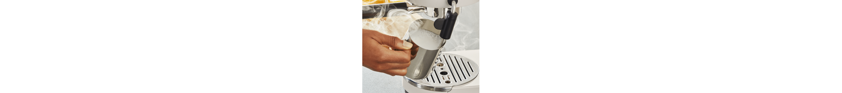 Milk being frothed with a milk frother