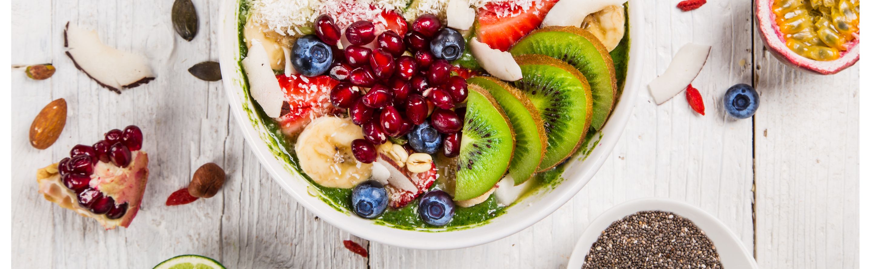 Smoothie bowl topped with a variety of fresh fruits