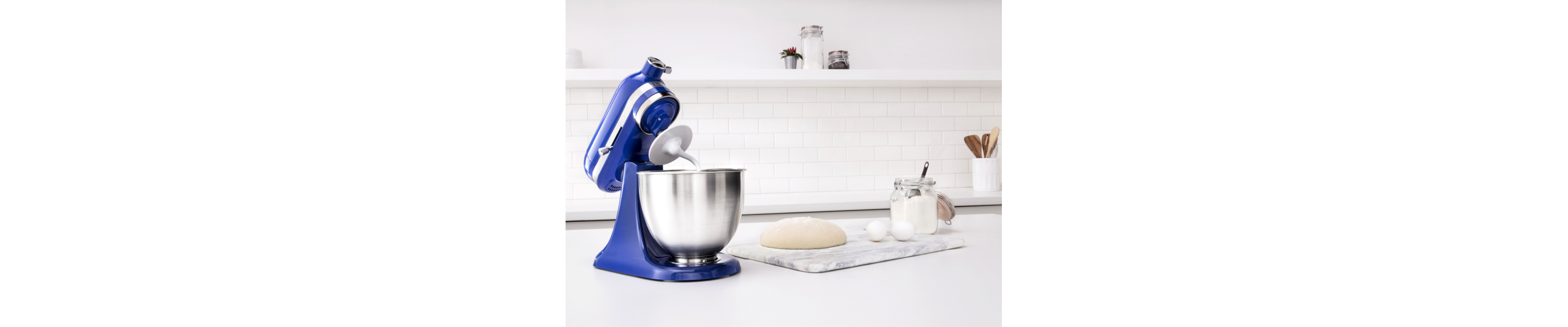 A KitchenAid® stand mixer with a dough hook attachment