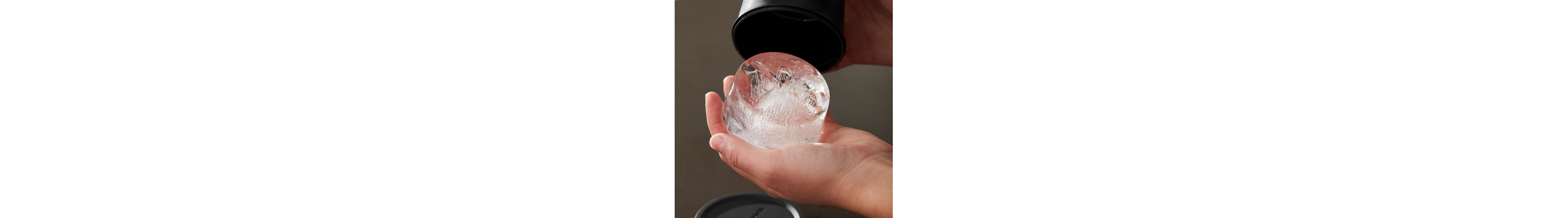 Person removing ice from ice mold