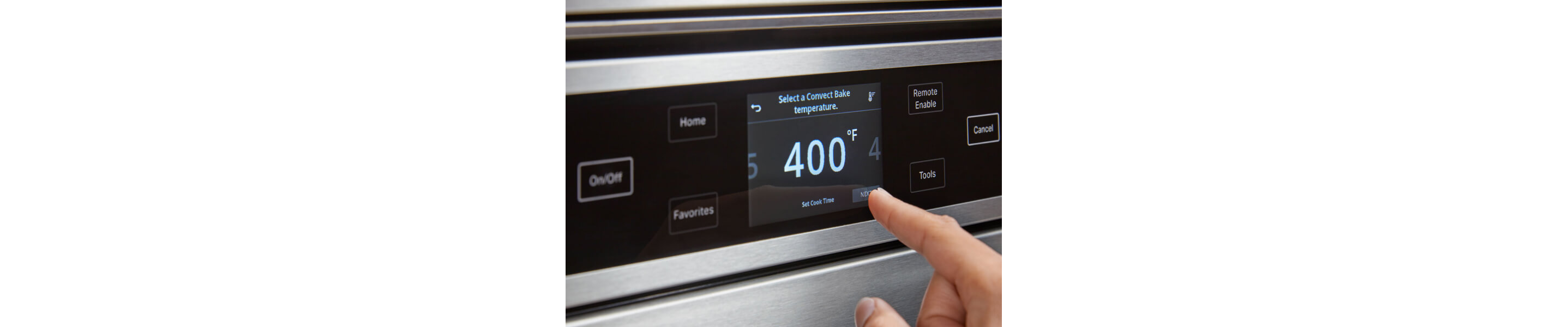 Person preheating the oven to 400°F on oven touchscreen