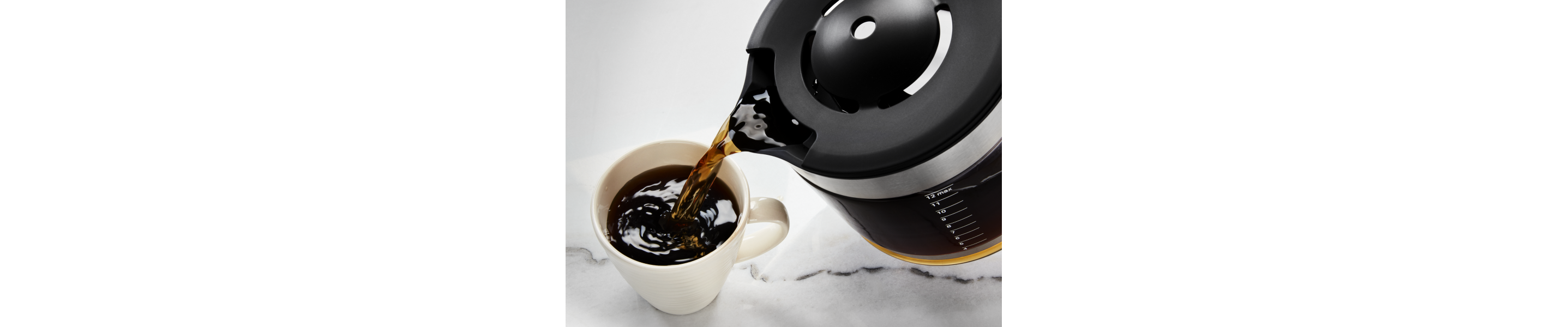 Coffee being poured into coffee cup