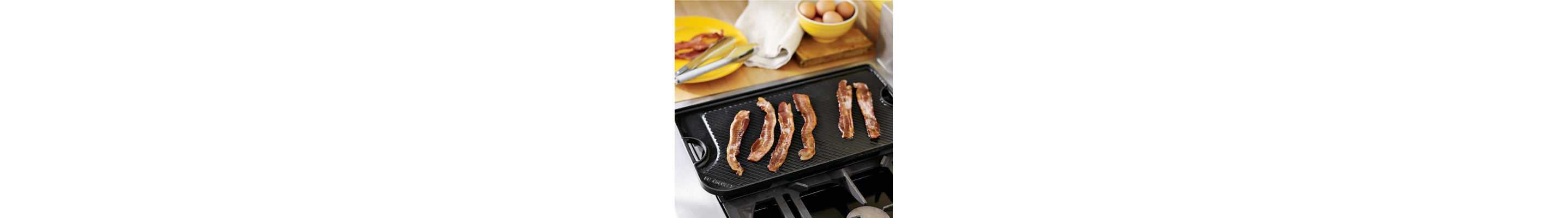 Bacon frying on a griddle