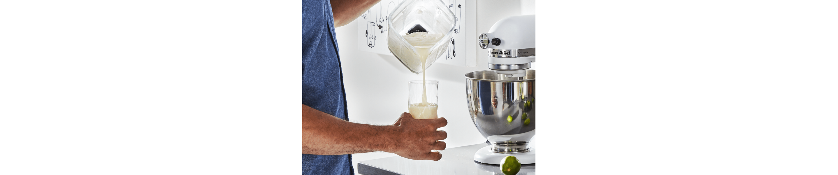 Person pouring horchata from blender into glass