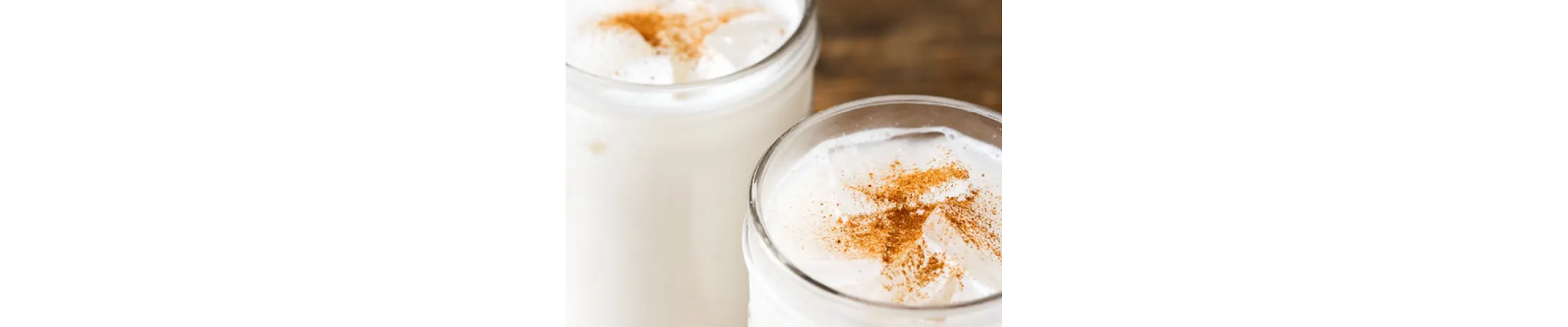 Horchata in a glass with cinnamon sprinkled on top
