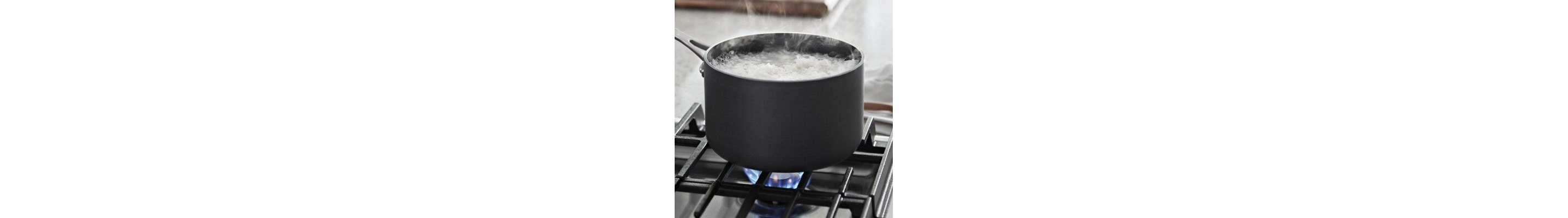 Water boiling in a saucepan on a gas cooktop
