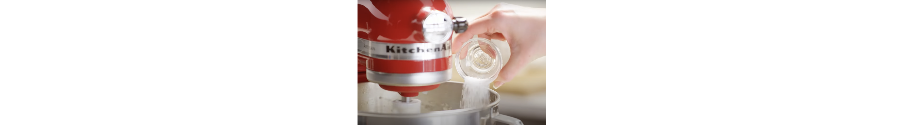 Pouring salt into a stand mixer bowl