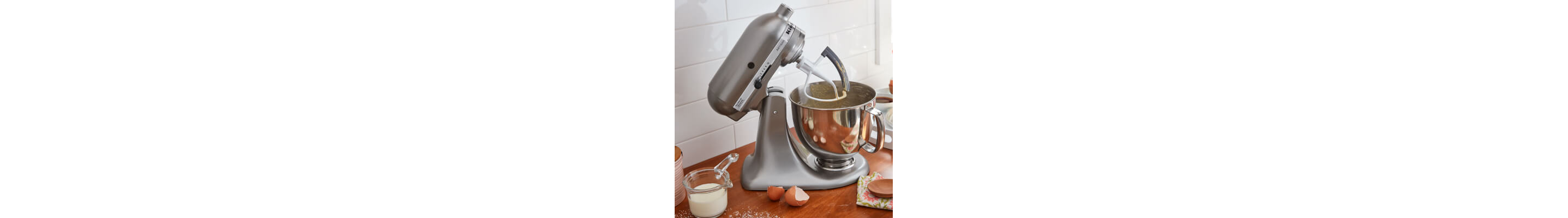 KitchenAid® stand mixer with milk and eggs on counter