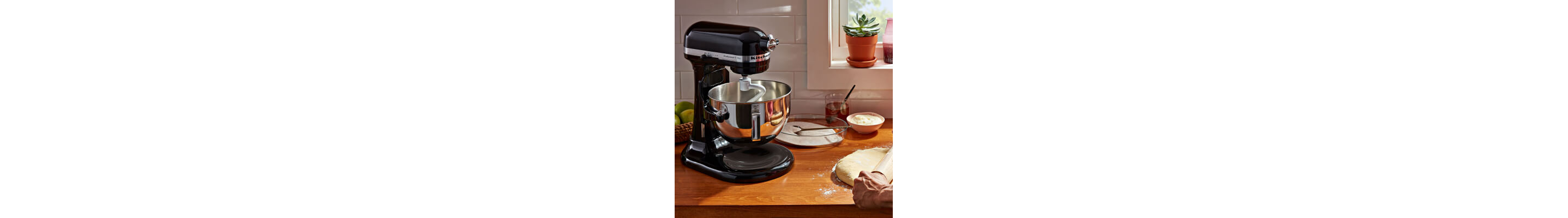 KitchenAid® stand mixer with pasta ingredients on counter