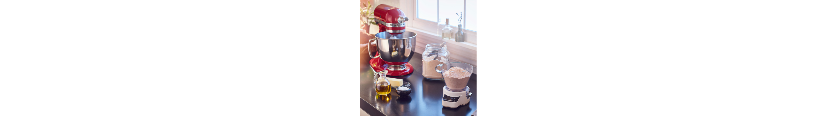 KitchenAid® stand mixer on counter with baking ingredients