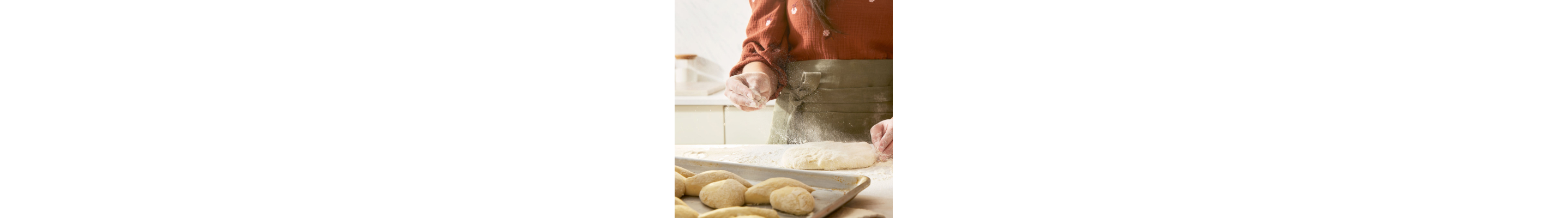 Flour being sprinkled on dough