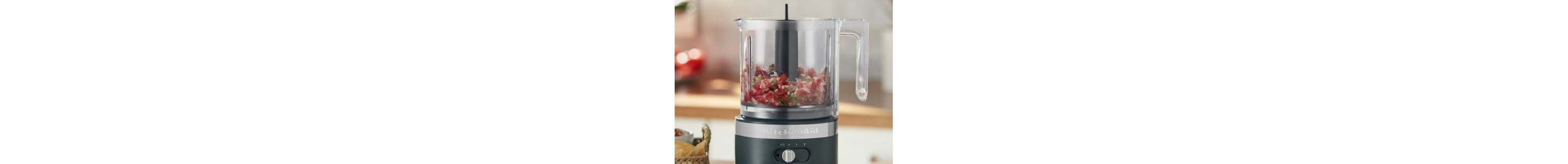 A KitchenAid® food processor filled with tabouli ingredients