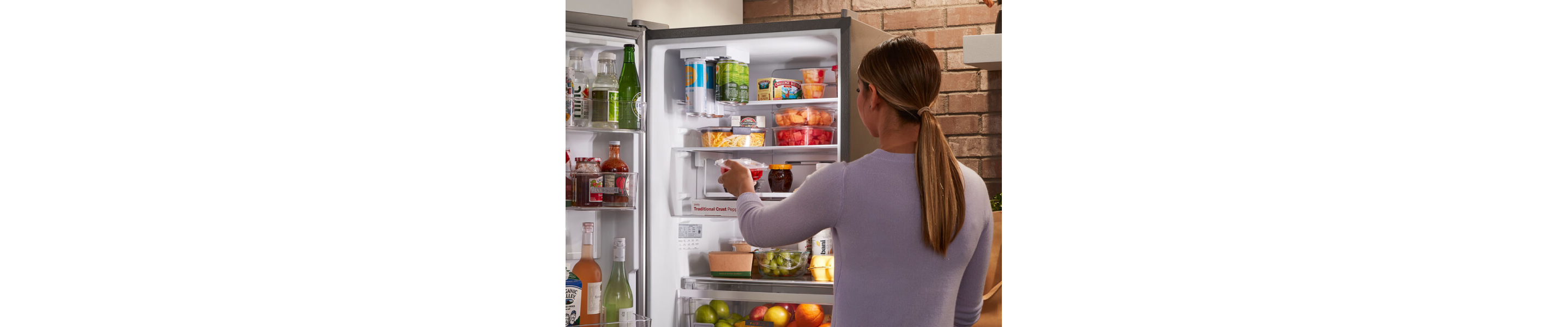 Person grabbing ingredients from the refrigerator