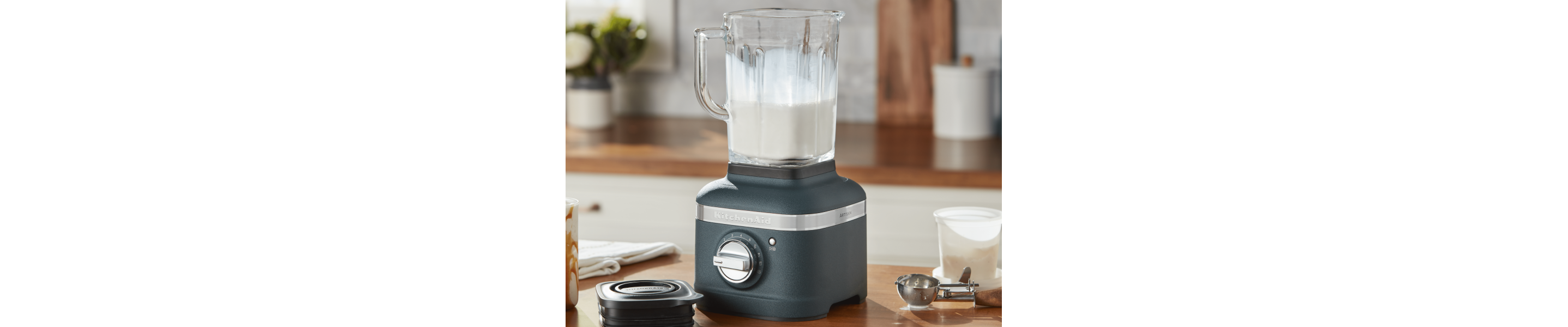 A person using a KitchenAid® blender.