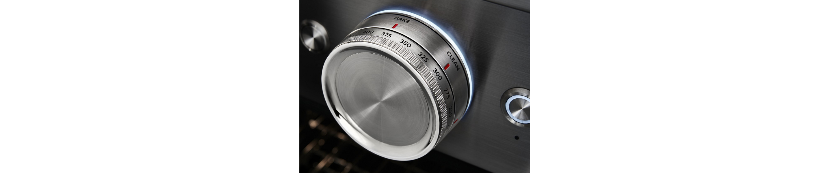 Close-up of oven temperature controls set to bake 