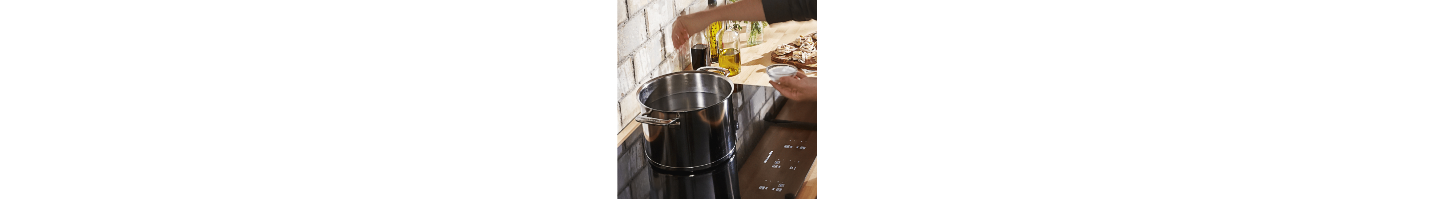 Pot of water boiling on an electric cooktop