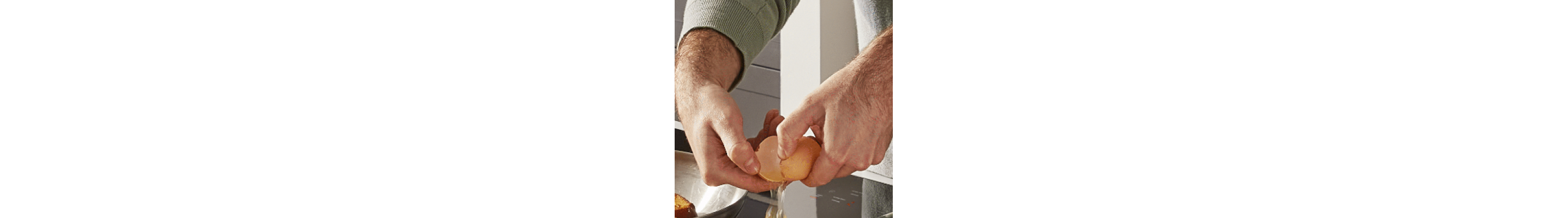 Person cracking an egg
