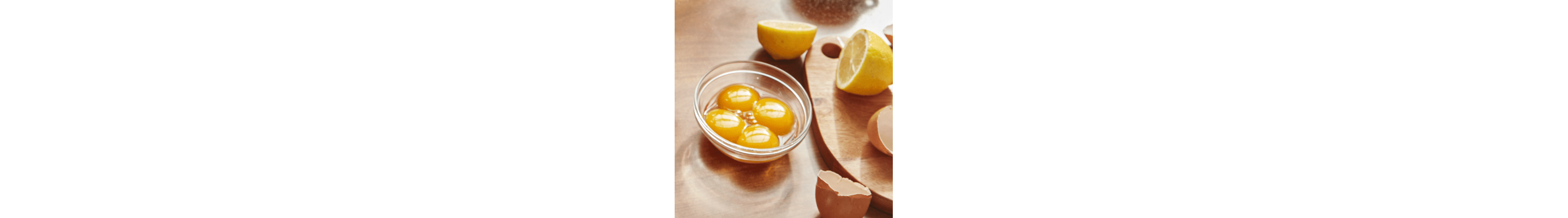 Four eggs in a small glass bowl