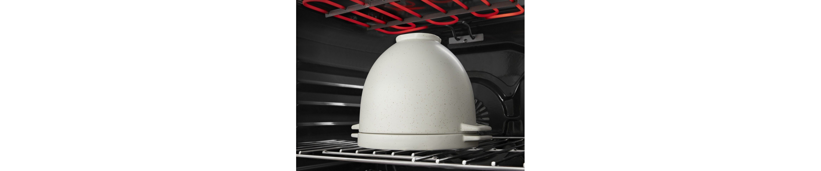 Bread proofing bowl with the lid on in the oven