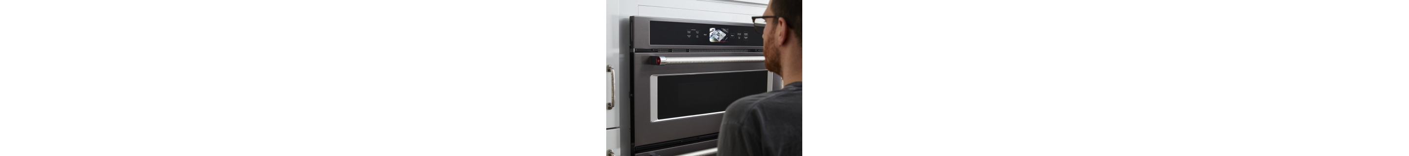 Person standing in front of a wall oven