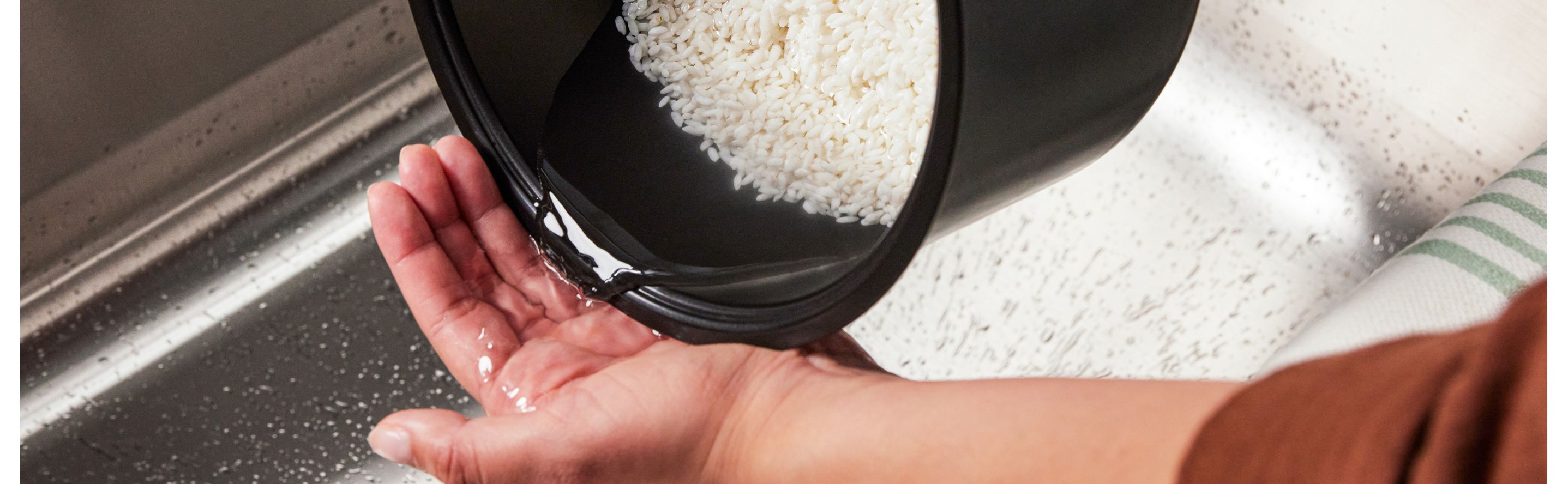 Person rinsing rice