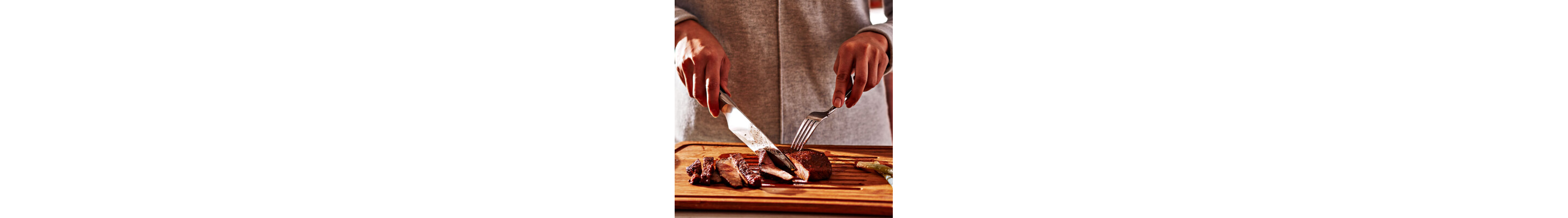 Person slicing steak