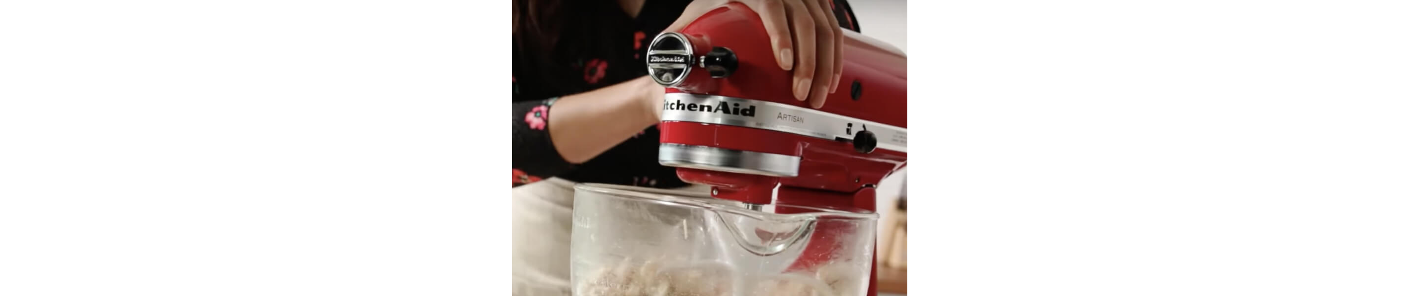 KitchenAid® stand mixer shredding cooked chicken.