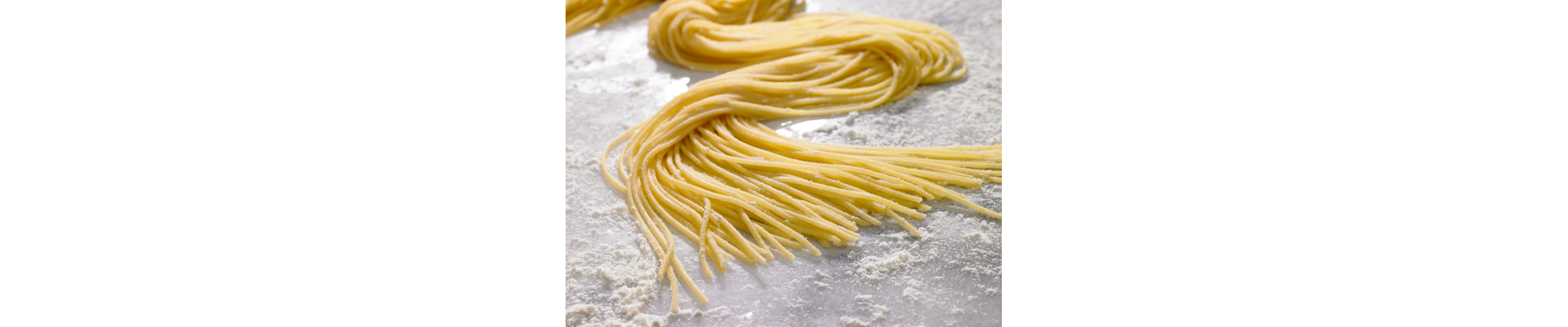  Nest of spaghetti laying in flour