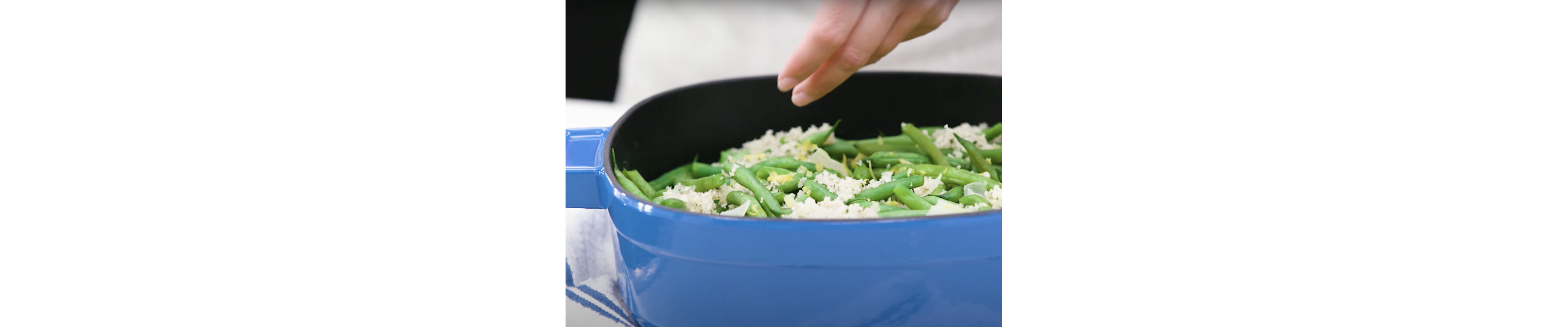 Green beans cooking in a dutch oven