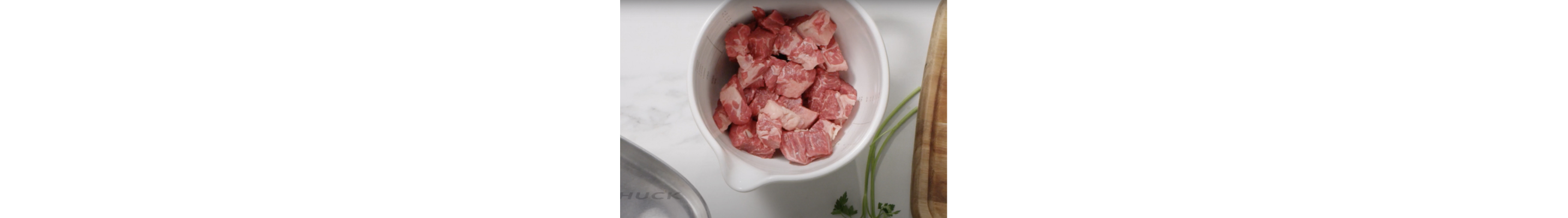Bowl with chilled cubed meat
