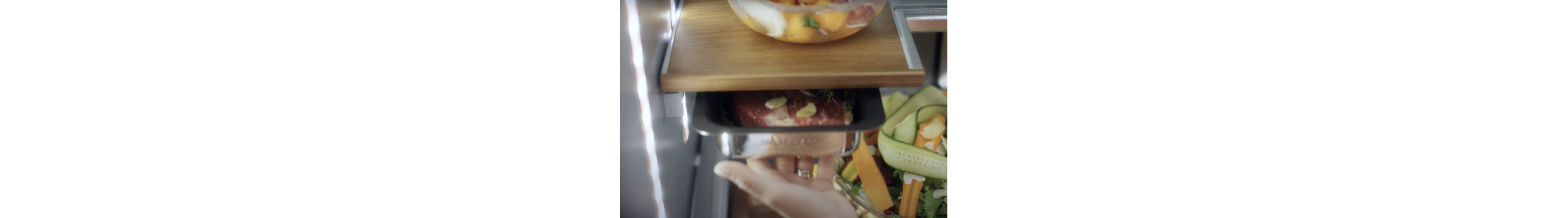 Meat in a marinating drawer in a KitchenAid brand refrigerator