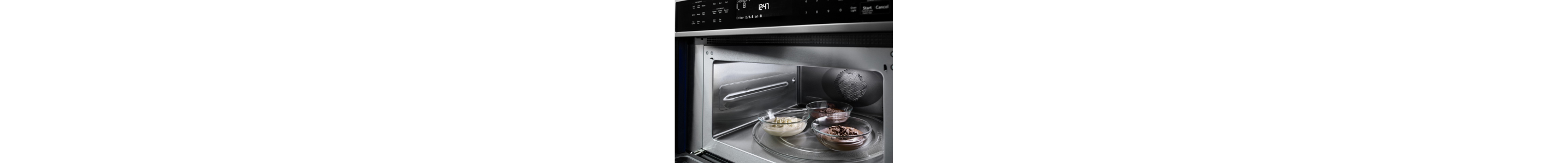 Three small dishes inside open microwave
