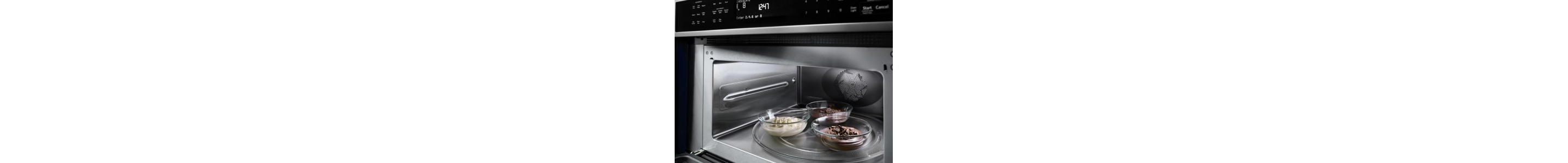Three small dishes inside open microwave