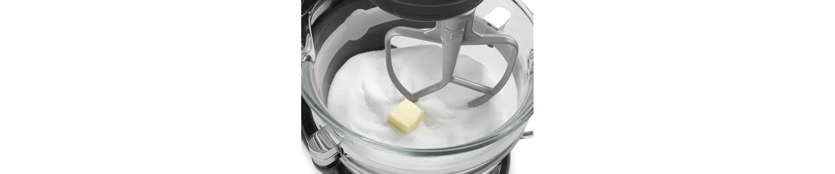 A closeup of a KitchenAid® stand mixer flat beater accessory.