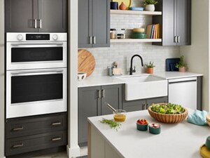 White KitchenAid® wall oven and dishwasher in a small kitchen