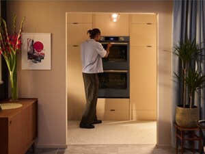 Person opening the top oven of a Juniper KitchenAid® Double Wall Oven