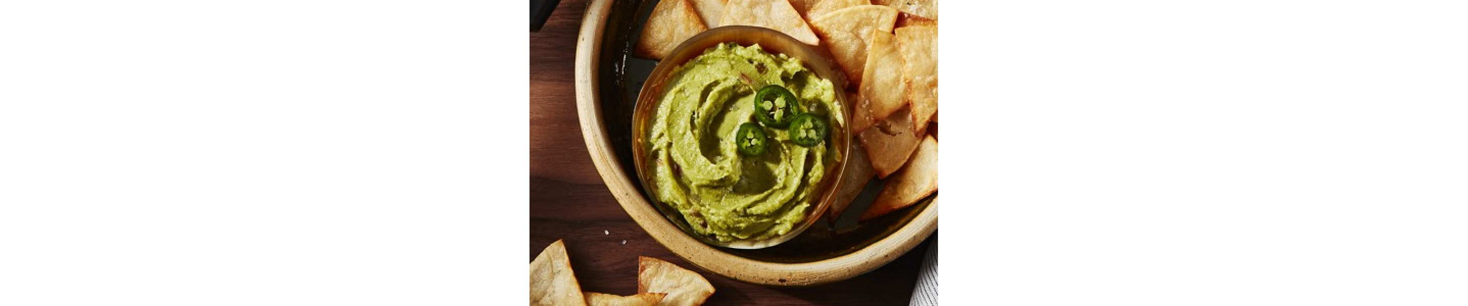 Guacamole in bowl with chips