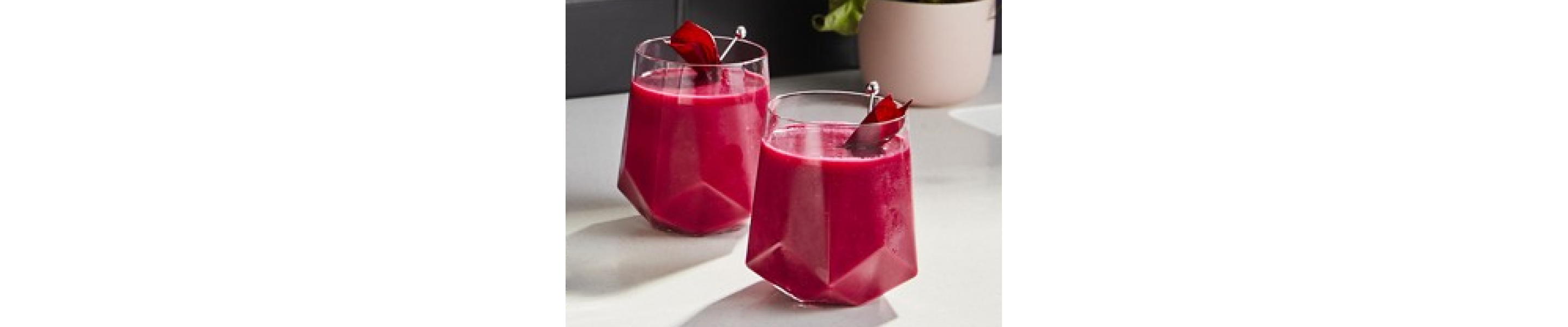 Smoothies in glasses on counter