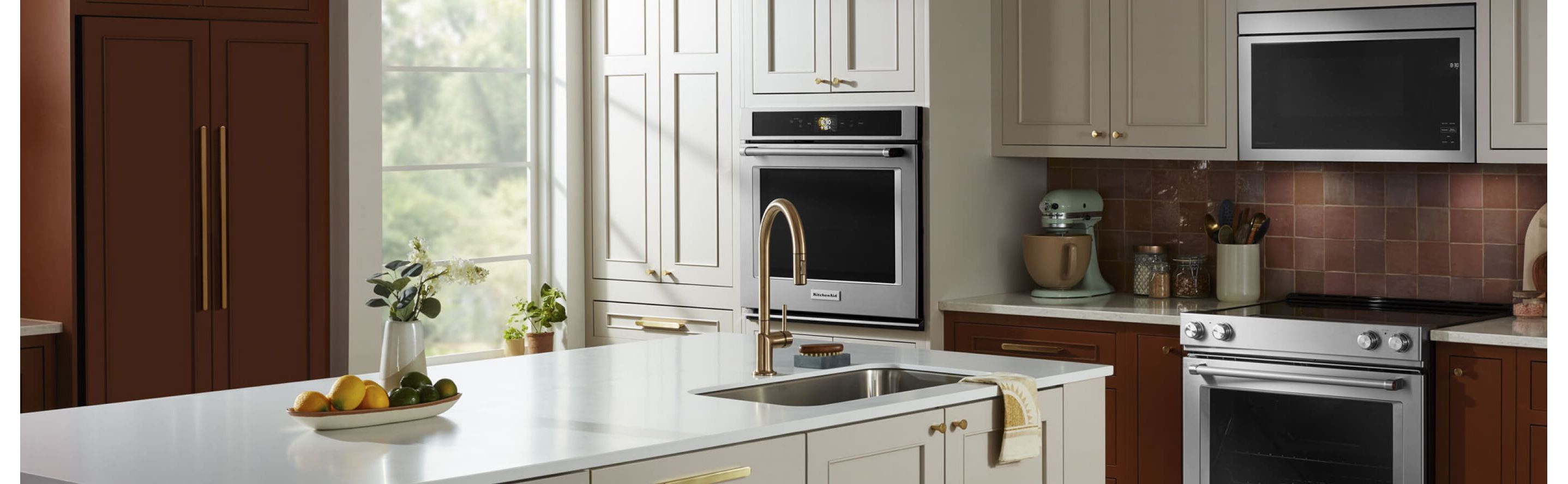 KitchenAid® refrigerator, oven and microwave appliance suite in a modern kitchen