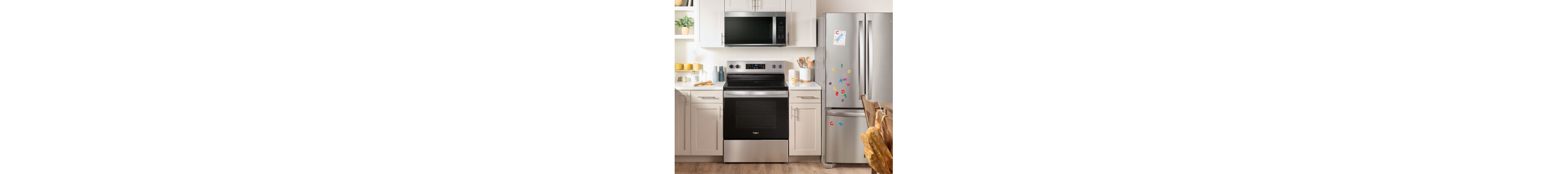 KitchenAid® oven, microwave and refrigerator appliance suite in a modern kitchen