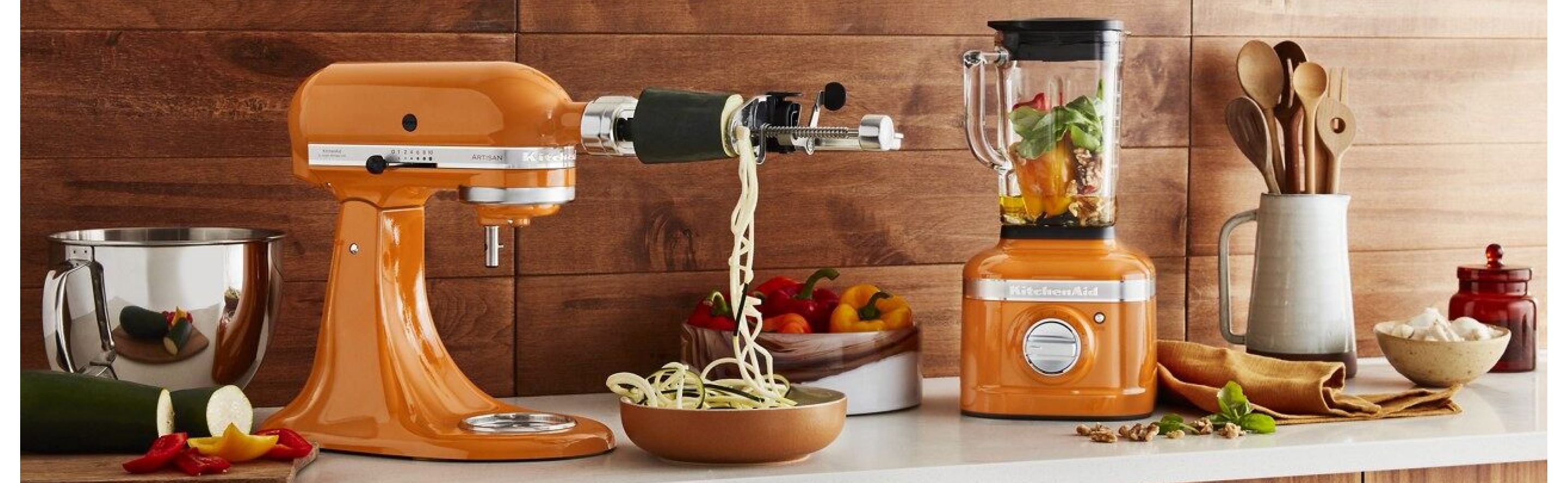 Honey colored KitchenAid® stand mixer and blender on countertop